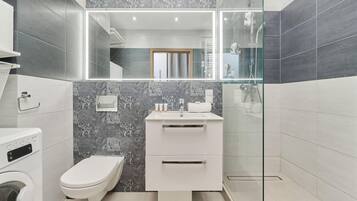 Shower, hair dryer, towels, shampoo