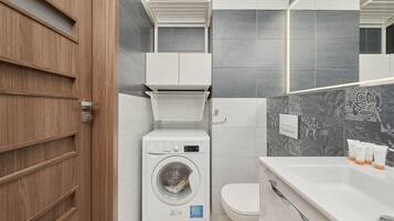 Shower, hair dryer, towels, shampoo