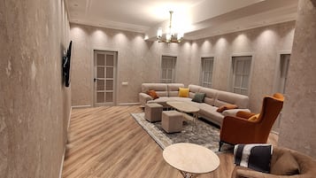 Family apartment 100m from the main building 6th floor | Living area | 42-inch Smart TV with cable channels