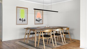 Enjoy meals in this dining area with a table, chairs, and a menu.