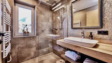 Shower, hair dryer, towels, soap