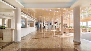 A spacious lobby with marble flooring, large columns, and modern lighting fixtures. - Villa Arausa (Vodice)