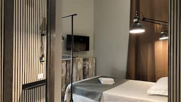 Habitación básica, 1 cama individual | Edredón, espacio para trabajar con laptop, wifi gratis y ropa de cama