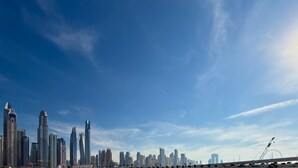 A city skyline with high-rise buildings under a clear sky. - LUX  Luxury Sunrise Beachfront Suite 2 (Dubai)