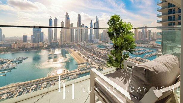 A high-rise luxury hotel in Dubai with a view of the city skyline, marina, and water bodies. - LUX  Luxury Sunrise Beachfront Suite 2 (Dubai)