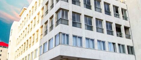 A multi-story hotel with a prominent restaurant on the ground floor named 'Miyabi Restaurant.'