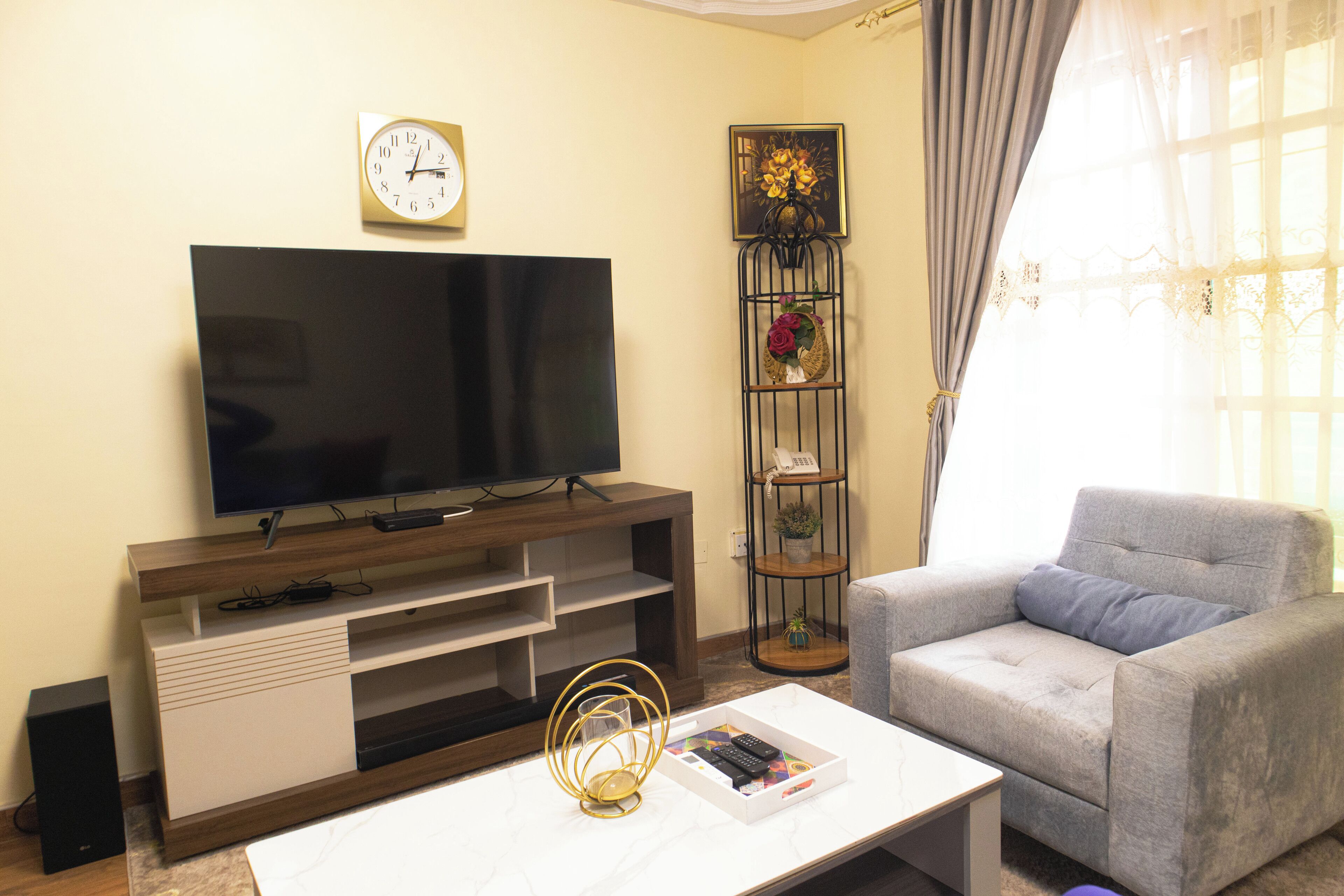 Family Apartment | Living area | 55-inch TV with satellite channels, fireplace