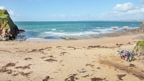 A beach with rocky cliffs and calm sea. - 3 bedroom accommodation in Hope Cove, near Kingsbridge (Hope Cove, near Kingsbridge)
