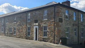 A stone building with multiple windows and a door, labeled "Blackwood Residence." - Blackwood Residence (Accrington)