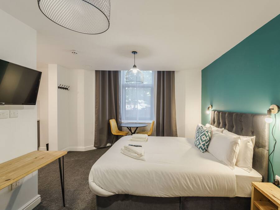 Ropa de cama de alta calidad y cortinas blackout