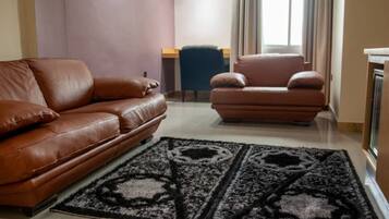 Senior Suite | Living area | Flat-screen TV