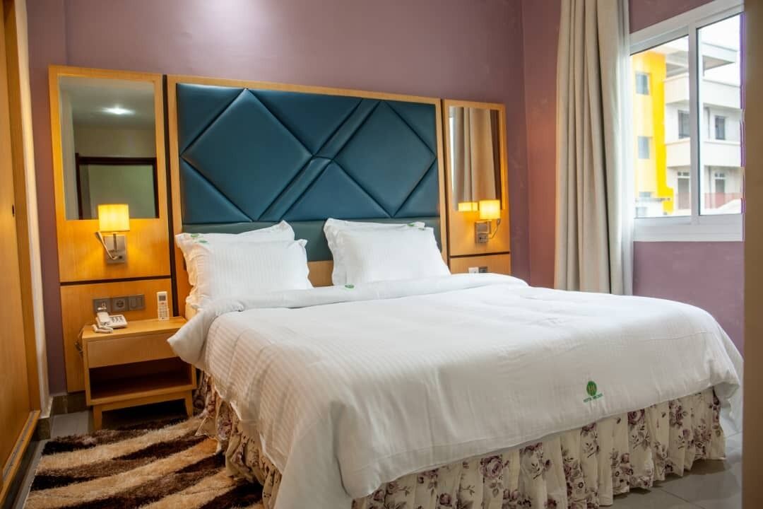 Standard Double Room | Minibar, in-room safe, desk, blackout drapes