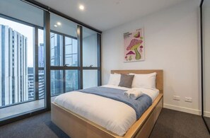 Enjoy a comfortable stay in this stylish room with a large bed and city views.