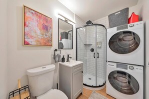 Shower, hair dryer, towels, soap