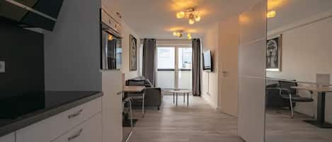 City Apartment | Living area | 40-inch LCD TV with satellite channels