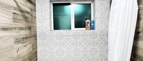 Shower, hair dryer, towels, soap