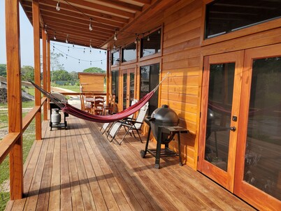 A stunning private estate situated on 6.5 acres along the Mopan River with pool and water slide.