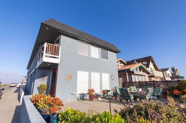 Stunning two-story residence with a balcony and beautifully maintained garden.