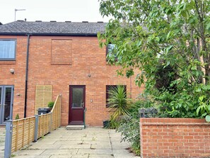 Stunning home surrounded by lush greenery and a charming garden.