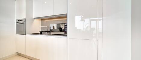 Coffee/tea maker, fridge, microwave, oven