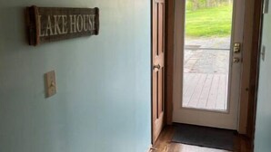 A wooden door with a sign reading "LAKE HOUSE" above it, leading to a porch with a wooden floor. - "Eagle's Cliff" at Lake Cumberland. Relaxing Beautiful Front Porch Lake View!  (Nancy)