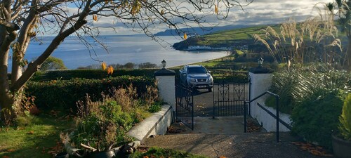 Traditional 5 bedroom house overlooking Cushendun bay. Pet friendly.