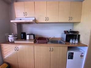 Comfort Studio, 1 Bedroom | Private kitchen | Mini-fridge, microwave, electric kettle, rice cooker - Island Travelers Acccommodation (Suva)