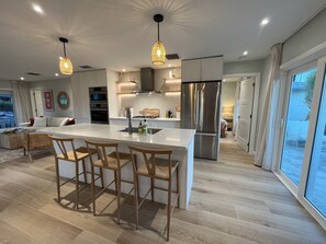 Fridge, microwave, oven, stovetop - Modern Beach Villa - Bahamian Pine (Treasure Cay)