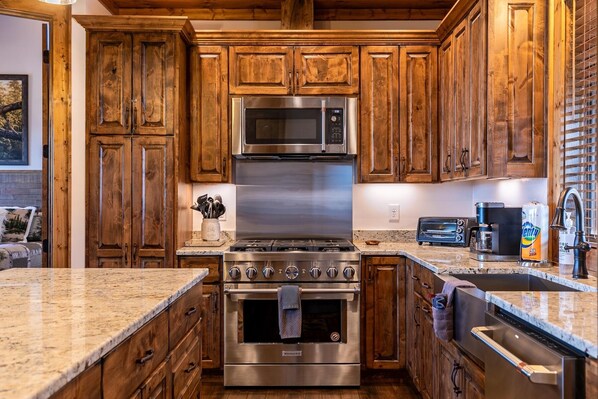 Enjoy cooking in this kitchen with a gas stove, microwave, and dishwasher.