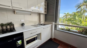 Fridge, microwave, stovetop, coffee/tea maker