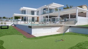 Une maison moderne à deux étages dotée d’une piscine, d’un espace salon extérieur et d’un véhicule tout-terrain pour jouer au golf.
