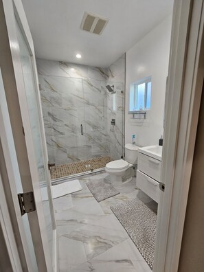 Shower, towels, soap, toilet paper