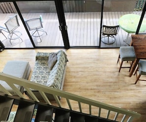 Relax on the balcony with a view, surrounded by a sofa and chairs.