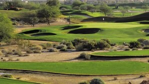 A golf course with multiple green areas and sand traps, surrounded by mountains and sparse vegetation. - The Grand Resort, 1 Acre Property.
"Huge Outdoor Space to Relax in the Sun!" (gilbert)