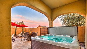 A hot tub with a view of the sky, surrounded by patio furniture and a brick wall. - The Grand Resort, 1 Acre Property.
"Huge Outdoor Space to Relax in the Sun!" (gilbert)