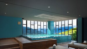 A modern spa with a wooden deck, a hot tub, and a view of mountains. - Taj Guras Kutir Resort & Spa, Gangtok (Gangtok)