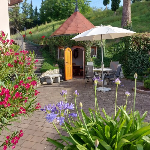 Ferienhaus mit Balkon, Terrasse, privater Terrasse, Gemeinschaftsgarten und WLAN