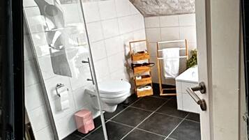 Bathtub, hair dryer, towels