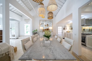 Enjoy meals in this dining area with a marble table and comfortable seating.