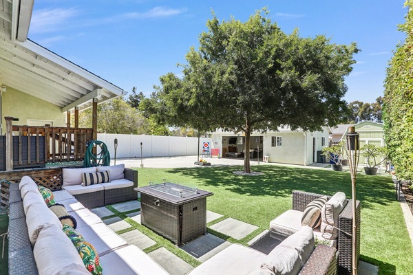 Back yard: outdoor seating for 9-10 with propane gas fire pit.