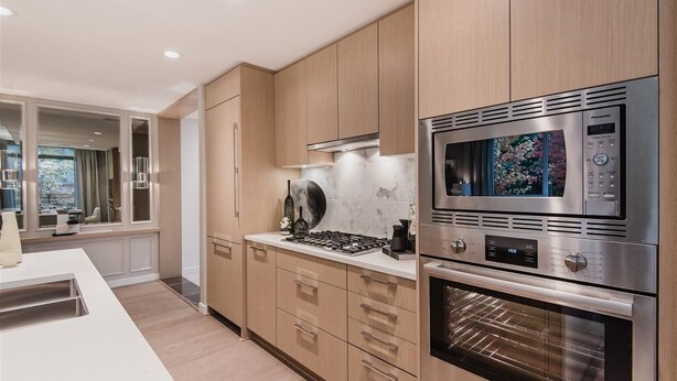 A modern kitchen with wooden cabinets, a Bosch oven, a Panasonic microwave, and a gas stove. - Vancouver (UBC ) one bed room in luxury house  (Vancouver)