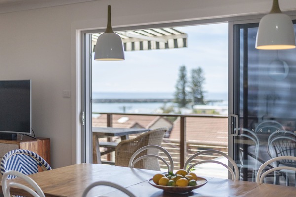 Bimbajong Yamba - Coast accommodation in Yamba town with Ocean views - Upstairs rear balcony with outdoor dining setting and ocean views