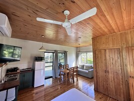 Superior Cabin, Non Smoking, River View | Living area | 40-cm TV with digital channels