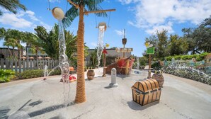 A water-themed area with a palm tree, a treasure chest, and a shipwreck. - 1052 3BR Luxury Resort House by Disney Orlando (Davenport)