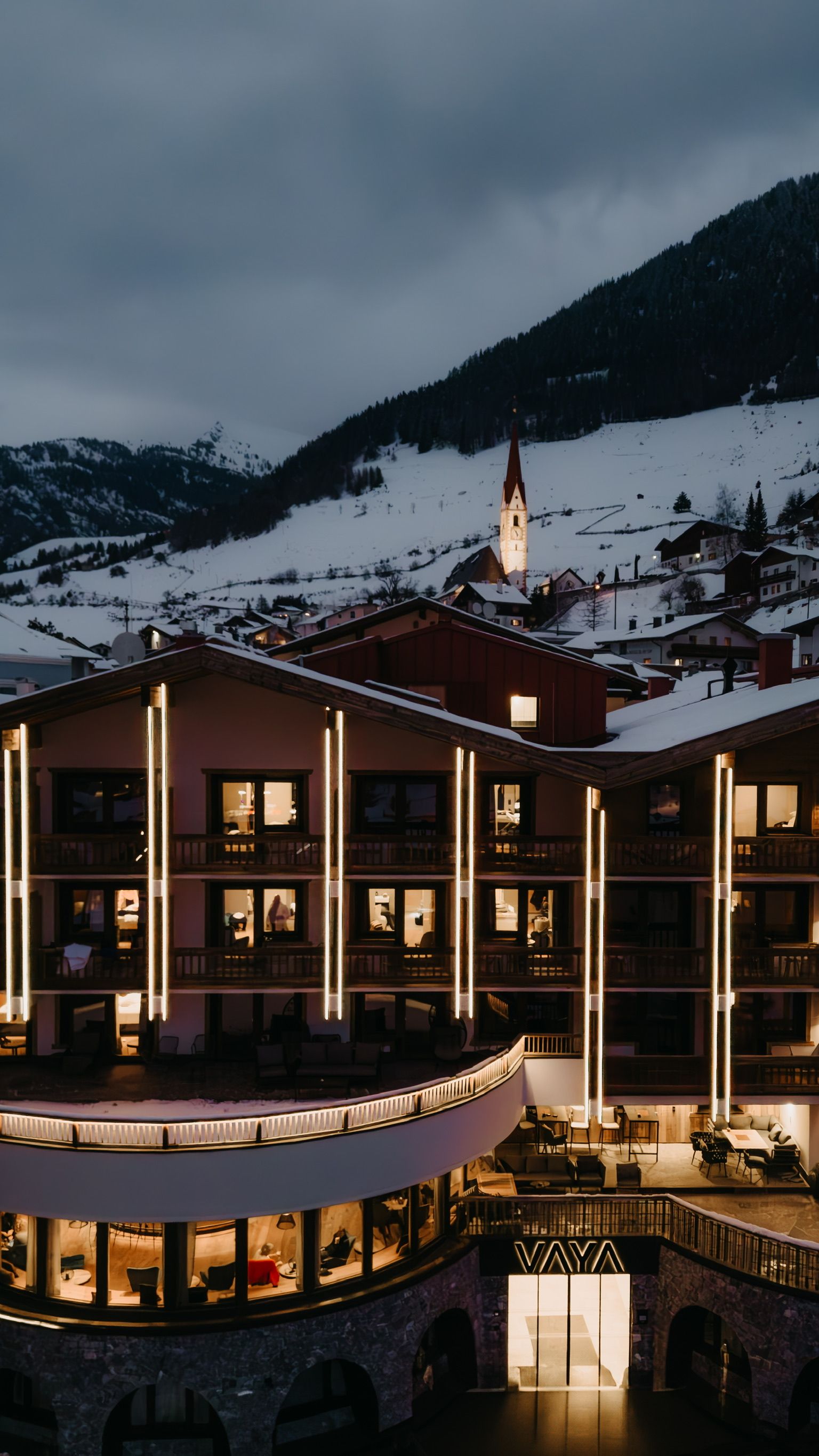 A hotel with multiple floors, balconies, and a central courtyard.