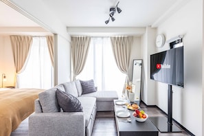 Design-huoneisto, tupakointi kielletty (Stay 1st 401) | Oleskelualue | Taulutelevisio