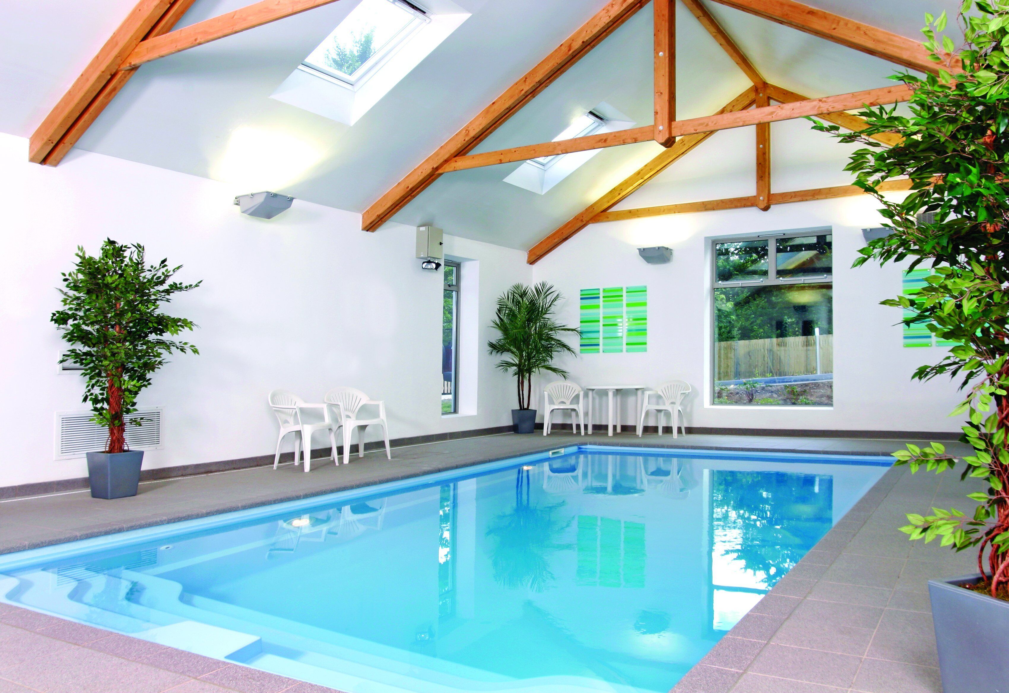 Indoor pool, seasonal outdoor pool, pool umbrellas, pool loungers