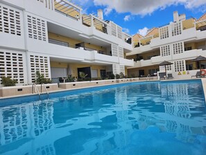 Outdoor pool, a heated pool - Amazing & Modern Apartment in Cabanas Beach with direct pool access (Sleeps 4) (Cabanas)