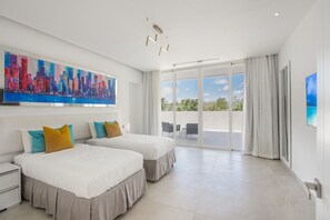 A modern hotel room with two beds, a large cityscape painting, and a balcony with a view. - Palmas 15: Luxury villa w/ mosquito net, lap-pool, Jacuzzi, staff & golf cart (Punta Cana)