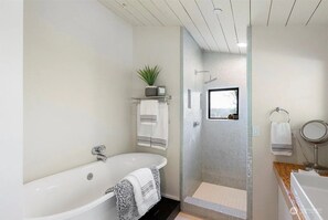 Bathtub, hair dryer, towels, soap